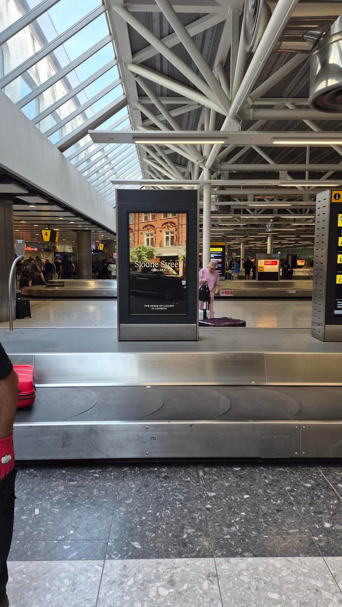 Sloane Street Chelsea creative featuring a London taxi cab, airport OOH advertising on a digital totem unit at London Heathrow arrivals hall, Terminal 3
